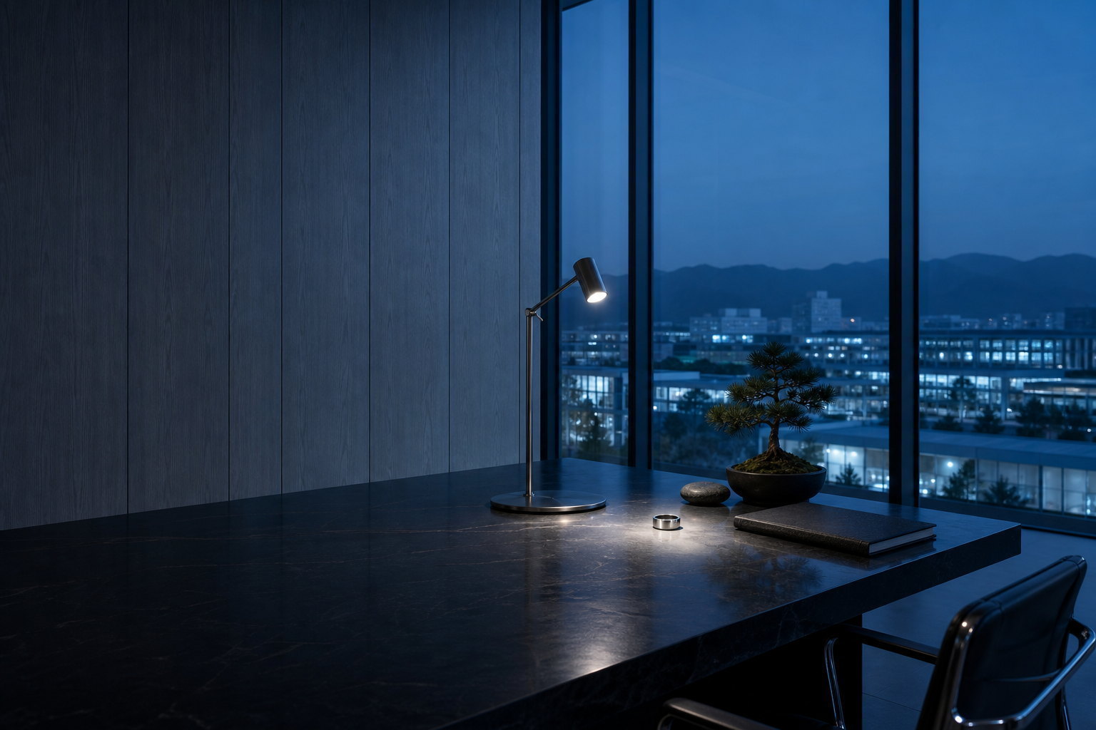 Hitrons executive workspace at blue hour — TAIJI smart ring on the desk with the Hong Kong Science Park skyline beyond